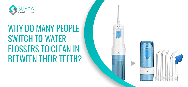 Why do many people switch to water flossers to clean in between their teeth?